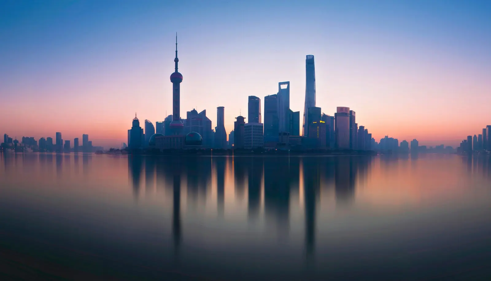 Shanghai skyline and the Huangpu River at dusk
